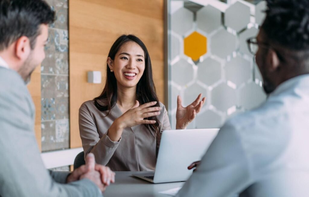 Business professionals discussing financial strategy during a meeting in a modern office